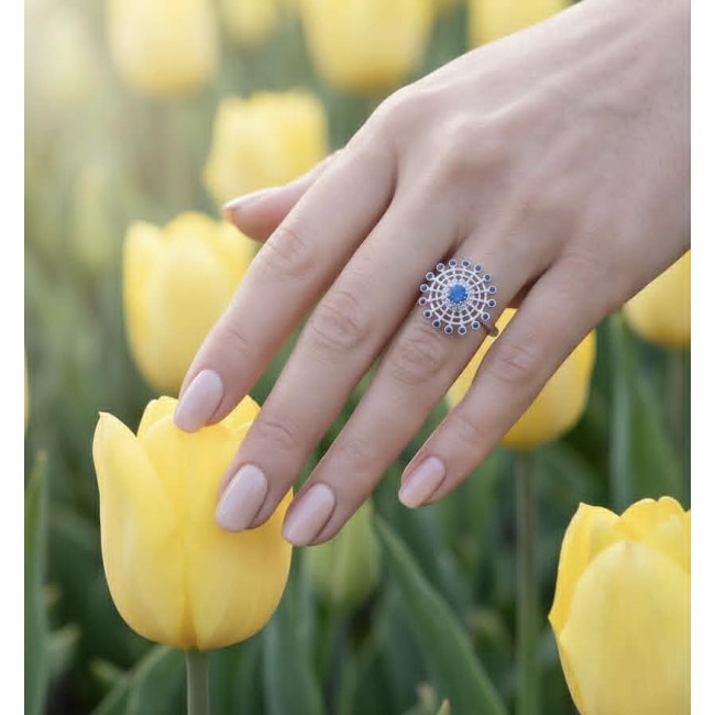 Star 2.2 carat natural Sapphire .925 Sterling Silver Perfectly handcrafted Ring s. 7 - Sapphire ring on hand among yellow tulips, top view.