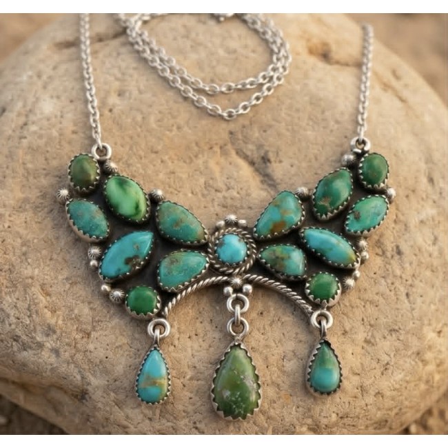 Go West! Authentic Kingman Turquoise .925 Sterling Silver handmade Statement necklace; back covered with silver - Front view of Kingman Turquoise sterling silver necklace on a rock.