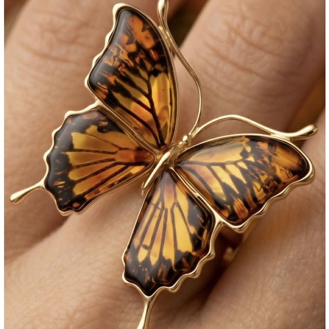 Golden Butterfly Authentic Baltic Amber .925 Sterling Silver dipped in 22K Gold handcrafted ring; s. 7 adjustable - Butterfly amber ring worn on hand, close-up detail.