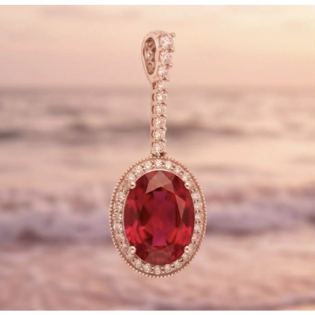 Giovanna Natural 20.8 carat Red Topaz .925 Sterling Silver handcrafted Statement pendant - Close-up of Giovanna Red Topaz pendant against a blurred sunset background