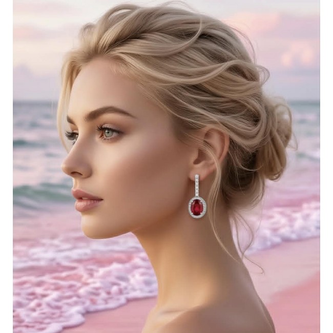 Clarissa - authentic 27.4 carat Ruby .925 Sterling Silver dipped in rhodium handcrafted Statement earrings - Side view of Clarissa ruby earring worn by a person on a beach.