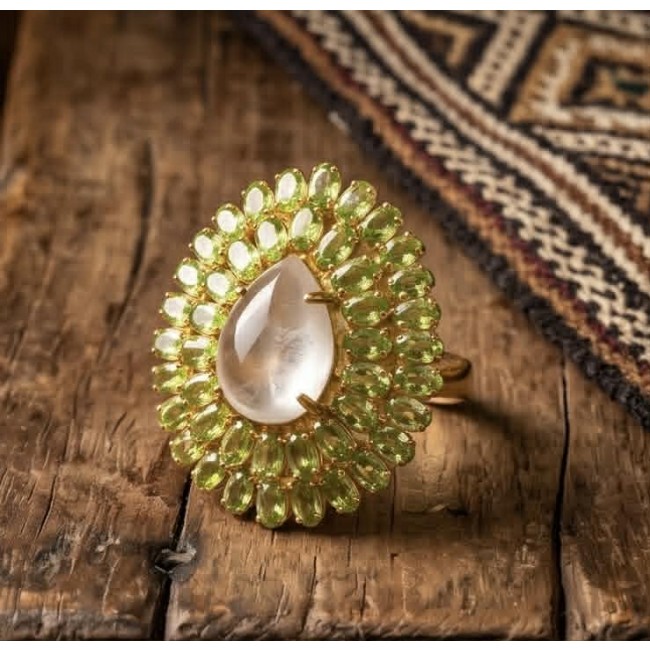 Francesca - Brazilian Rose Quartz Peridot 28.5 carat 18K Gold over .925 Sterling Silver handcrafted Large Ring size 7 - Close-up of Francesca ring with rose quartz and peridot stones on wood.