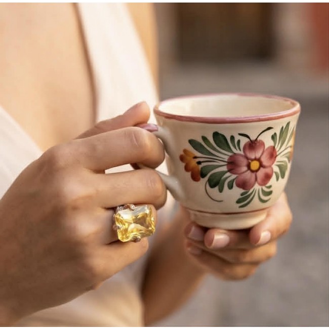 Solid 35.8 carat Genuine Yellow Sapphire 2 tones .925 Sterling Silver handcrafted ring size 7 adjustable - Yellow sapphire ring on hand holding floral cup, close-up view.