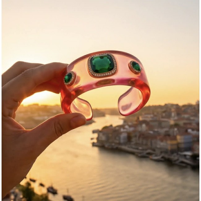 Candy Store - Modern Design Natural Pink Raisin Peridot .925 Sterling Silver bracelet - Pink resin bracelet with green stones held against sunset skyline backdrop