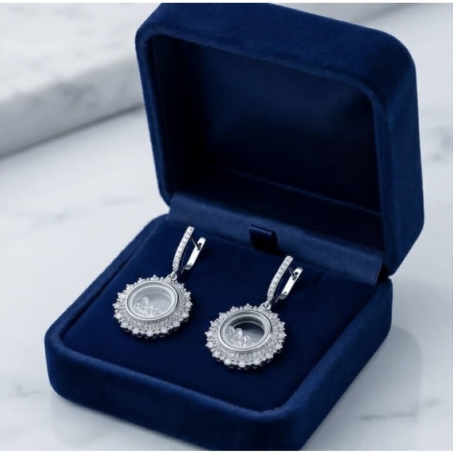 Floating Memories 12.5 carat White Sapphire .925 Sterling Silver Handcrafted Statement earrings - Floating Memories earrings in box, front view.