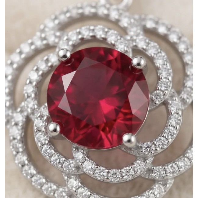 Giovanna Natural 7.8 carat Red Topaz .925 Sterling Silver handcrafted Statement earrings - Close-up of 7.8 carat red topaz in sterling silver setting