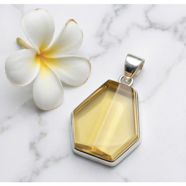 Prehistoric Authentic faceted Golden Baltic Amber .925 Sterling Silver beautifully handcrafted Pendant - Faceted golden Baltic amber pendant, top view with plumeria flower.