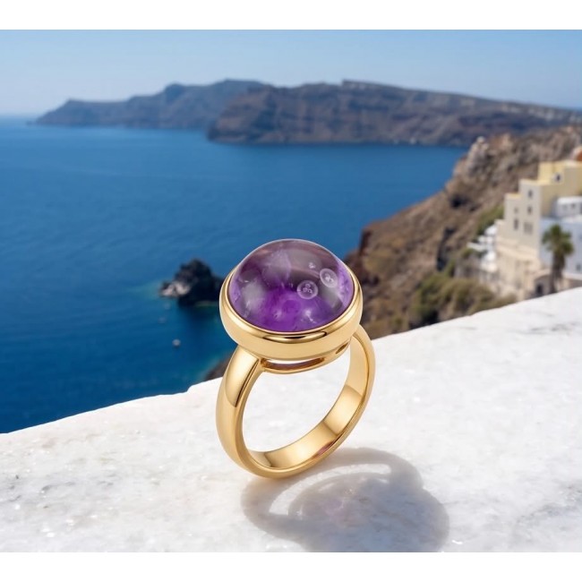 Purple Royalty 20.5 carat Amethyst .925 Sterling Silver dipped in 18K Gold Handcrafted Ring size 8 adjustable - Amethyst ring on marble ledge with ocean view in background.