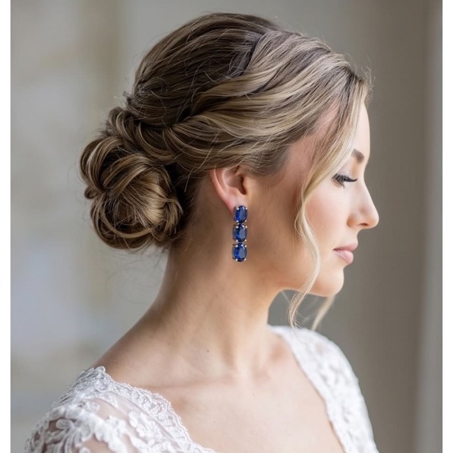 Deep Ocean 22.5 carat London Blue Topaz .925 Sterling Silver handmade Statement earrings - Side view of woman wearing Deep Ocean 22.5ct London Blue Topaz earrings