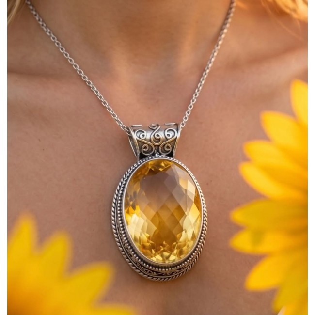 Sienna- amazing quality 30.7 CARAT genuine Brazilain Citrine RHODIUM over .925 Sterling Silver handmade pendant - Citrine pendant close-up, worn on neck, surrounded by yellow flowers.