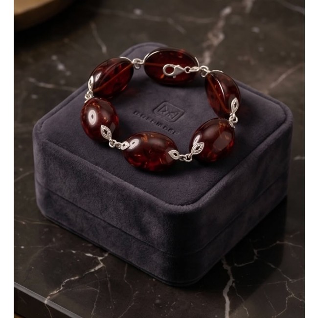 Excellent quality Cognac color Baltic Amber .925 Sterling Silver entirely handcrafted Bracelet - Cognac Baltic Amber bracelet on display box, top view.