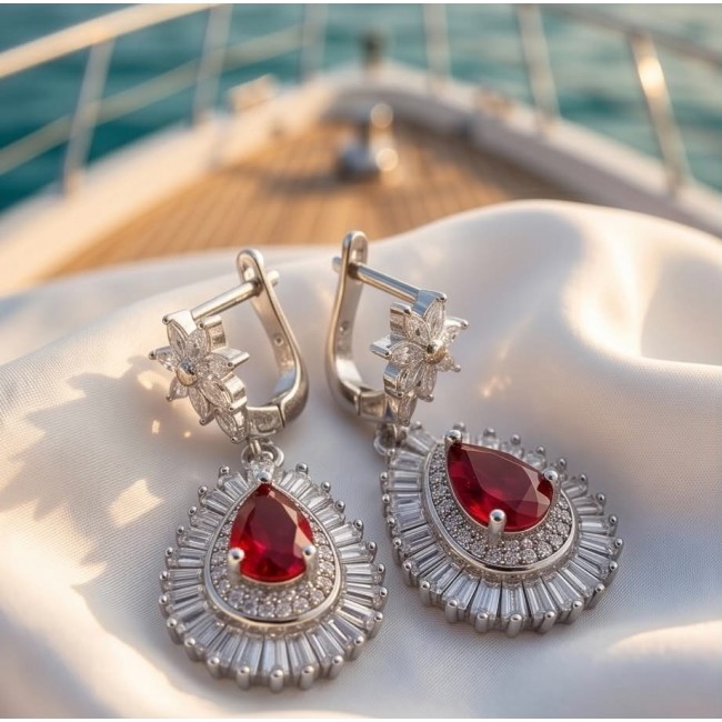 Magnificent Jewel 6.5 carat Ruby .925 Sterling Silver handcrafted incredible earrings - Close-up of ruby and silver earrings on a satin fabric background
