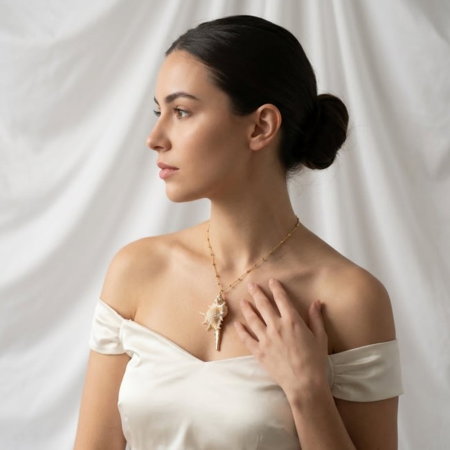 Vitamin Sea Large Oceab Shell 14K Gold over .925 Shell Sterling Silver necklace - Side view of woman wearing Vitamin Sea Large Ocean Shell necklace