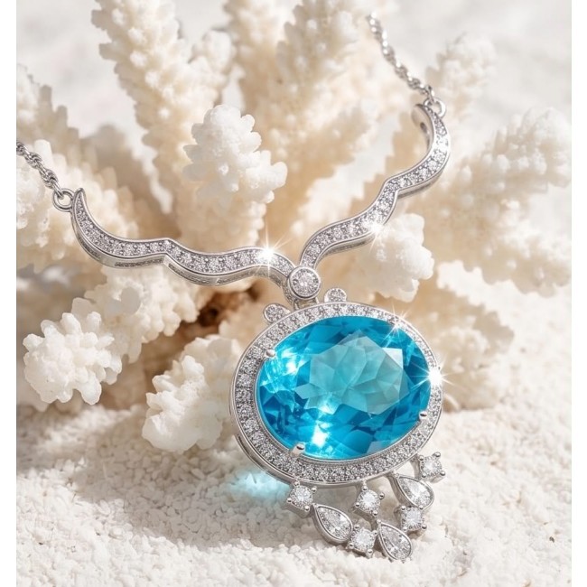 A Wild Ocean genuine 18.4 carat Paraiba Tourmaline .925 Sterling Silver handmade Statement necklace - Close-up of Paraiba Tourmaline necklace on white coral background.