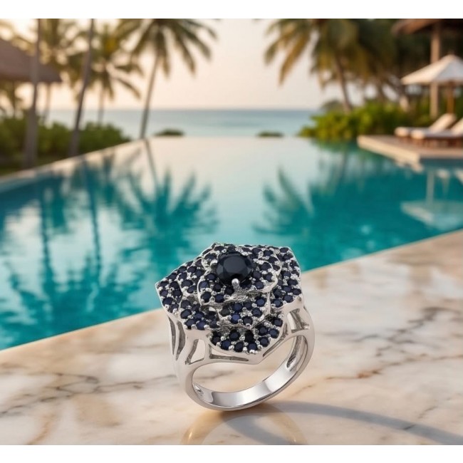 Blue Flower 12.2 carat natural Sapphire .925 Sterling Silver Perfectly handcrafted Ring s. 9 - Sapphire flower ring close-up on marble, pool and palm trees in background.
