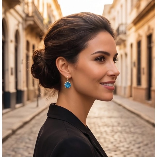 Atlantica 6.8 carat Swiss Blue Topaz 22K Gold over .925 Sterling Silver Handcrafted Statement earrings - Side view of woman wearing Atlantica Swiss Blue Topaz earrings
