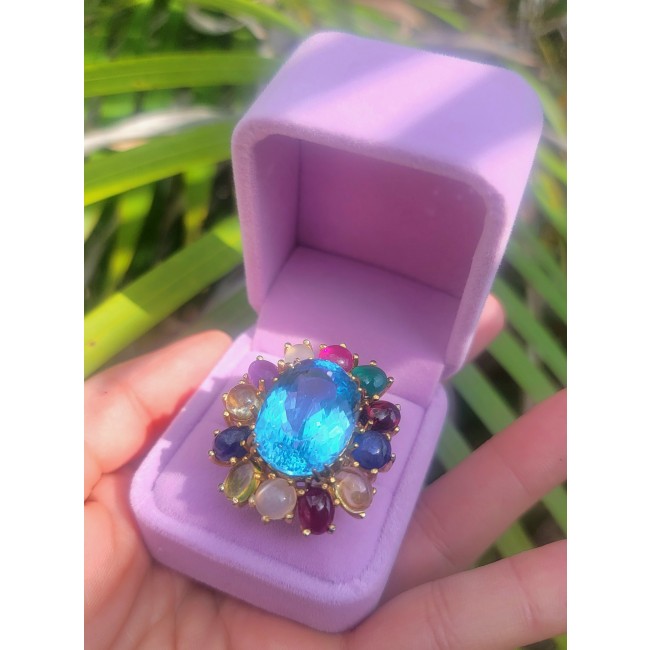 Dolce Vita 25.3 carat genuine Large Swiss Blue Topaz .925 Sterling Silver dipped in 22K Gold handcrafted Large ring size 8 - Swiss Blue Topaz ring in purple box, top view showing stone details.