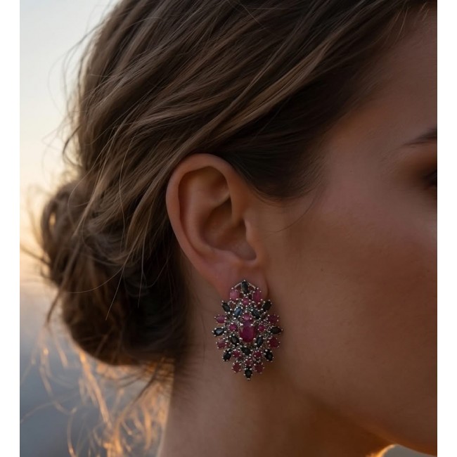 Bella Rosa Genuine 22.8 carat Ruby .925 Sterling Silver dipped in rhodium Statement brilliantly handcrafted earrings - Side view of Bella Rosa Ruby earrings worn, hair in an elegant updo.