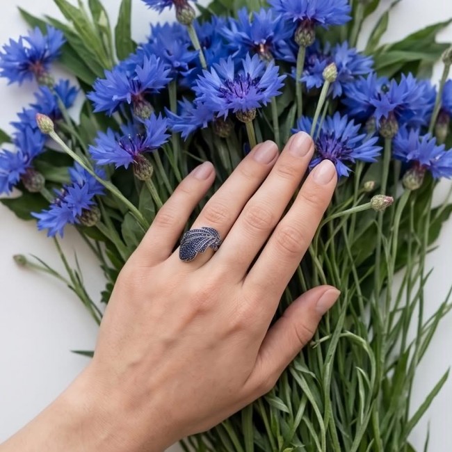 Blue Feather 5.2 carat natural Sapphire .925 Sterling Silver Perfectly handcrafted Ring s. 8 3/4 - Worn on hand with blue flowers; Blue Feather Sapphire Silver Ring.