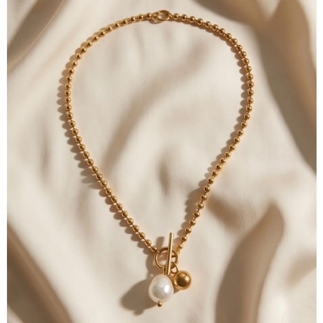 Top quality Natural Mother of pearl 10K Gold over .925 Sterling Silver handcrafted necklace - Gold beaded necklace with pearl, top view on fabric background