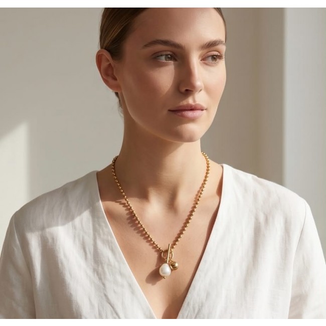 Top quality Natural Mother of pearl 10K Gold over .925 Sterling Silver handcrafted necklace - Woman wearing gold necklace with pearl pendant, front view.