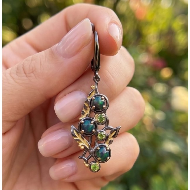 CAROLYN 4.2 carat Australian Black Opal black rhodium 18K Gold over .925 Sterling Silver incredible handcrafted Earrings - Australian Black Opal earring held in hand, close-up view.