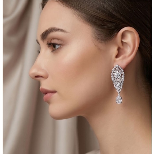 Veronica - Precious 35.5 carta White Topaz rhodium over .925 Sterling Silver .925 Sterling Silver Statement earrings - Side view of woman wearing Veronica white topaz earrings.