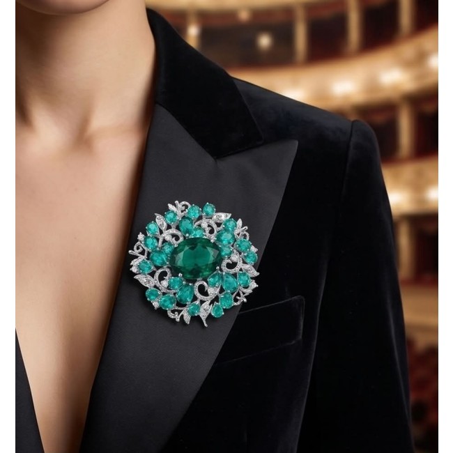 An Large 55.8 carat Vintage style Chrom Diopside from Eastern Siberia .925 Sterling Silver DIPPED IN RHODIUM handmade LARGE Pendant - Brooch - Woman wearing large chrom diopside brooch on black blazer. Front view.
