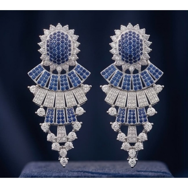 Authentic 4.7 carat Sapphire Rhodium over .925 Sterling Silver handcrafted Statement earrings - Close-up of sapphire and diamond drop earrings on a dark background