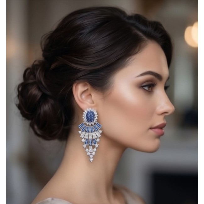 Authentic 4.7 carat Sapphire Rhodium over .925 Sterling Silver handcrafted Statement earrings - Side view: Sapphire earrings on model with elegant updo hairstyle.