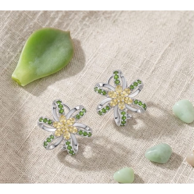 Wise Bliss Authentic 8.5 carat Chrome Diopside rhodium over .925 Sterling Silver handmade earrings - Floral earrings with green stones on textured fabric background.