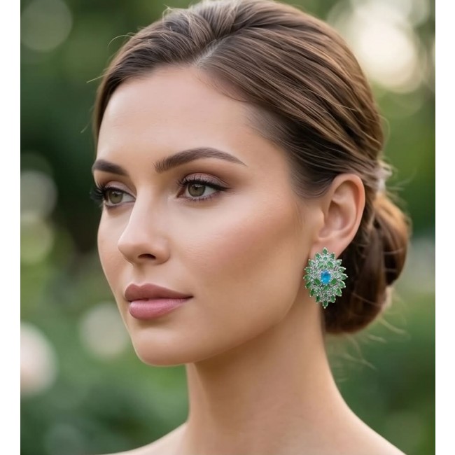 Fiammetta oval cut 4.2 carat Paraiba Tourmaline Tsavorite Garnet .925 Sterling Silver entirely handmade earrings - Woman wearing Fiammetta earrings with Paraiba Tourmaline, side view.