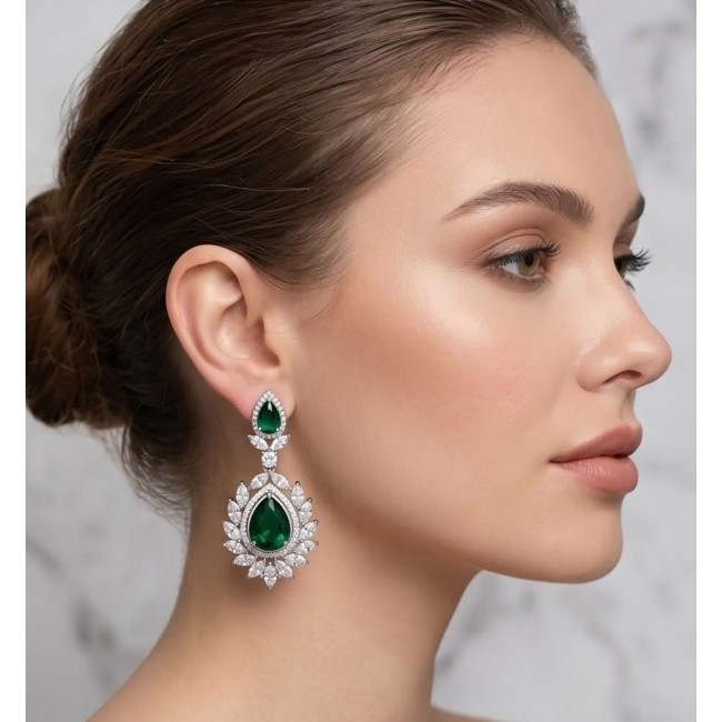 Magnificent Jewel 17.5 carat Emerald 14K white Gold over .925 Sterling Silver handcrafted earrings - Side view of woman wearing Magnificent Jewel emerald earrings