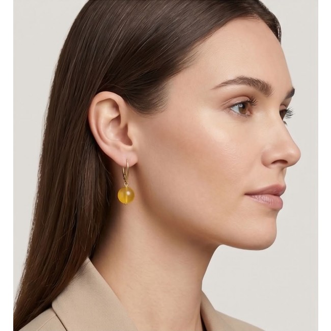Very Special product - Wonderful Butterscotch Baltic Amber .925 Sterling Silver DIPPED IN 14k Gold entirely handcrafted earrings - Side view of a Very Special Butterscotch Baltic Amb earring worn.