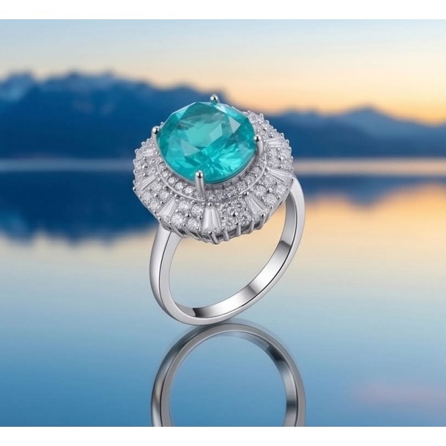 Wonderland 10.5 carat Brazilian Paraiba Tourmaline .925 Sterling Silver Handcrafted Ring size 9 - Paraiba tourmaline ring with diamonds, side view against serene landscape