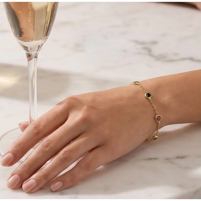 Authentic 7.5 carat Brazilian Watermelon Tourmaline 14K Gold over .925 Sterling Silver handmade Bracelet - Bracelet with tourmaline stones worn on hand, champagne glass nearby.