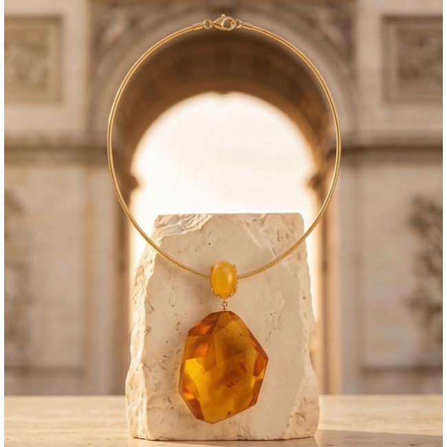 Wonderful Perfection real faceted Elegant Genuine Golden Baltic Amber 22K Gold over .925 Silver handcrafted Necklace - Golden necklace with faceted stone displayed on a stone pedestal.