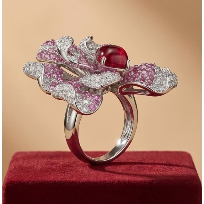 Wild Hibiscus 34.2 carat authentic Mozambique Ruby White Sapphire .925 Sterling Silver handcrafted Statement Ring size 6 - Side view of hibiscus-shaped ring with ruby and diamonds on red base.