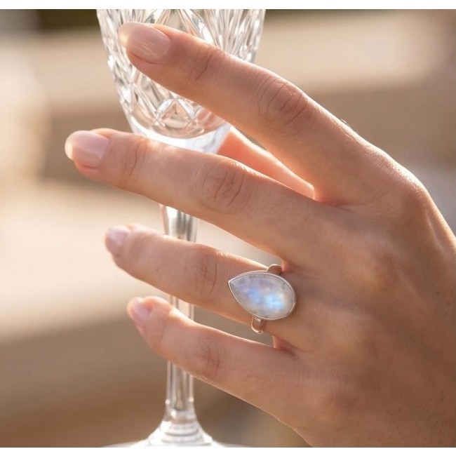 Rainbow Moonstone .925 Sterling Silver handmade ring s. 7 1/2 - Rainbow Moonstone ring worn on hand, holding a glass.