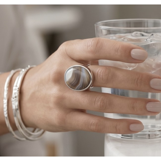 Simplicity Scentic Botswana Agate .925 Sterling Silver handcrafted Ring s. 8 adjustable - Worn on hand: Botswana Agate ring and silver bangles with a glass of water.