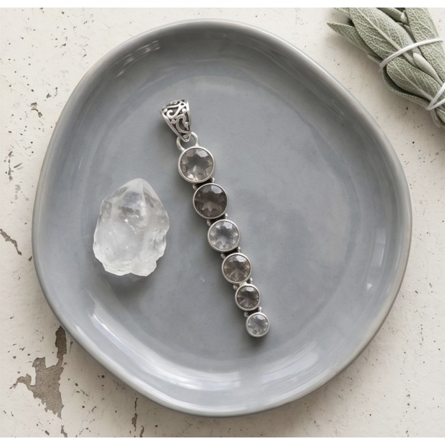 Penelope - 21.5 carat Smoky Topaz .925 Sterling Silver handmade Pendant - Penelope Smoky Topaz pendant on plate, top-down view.