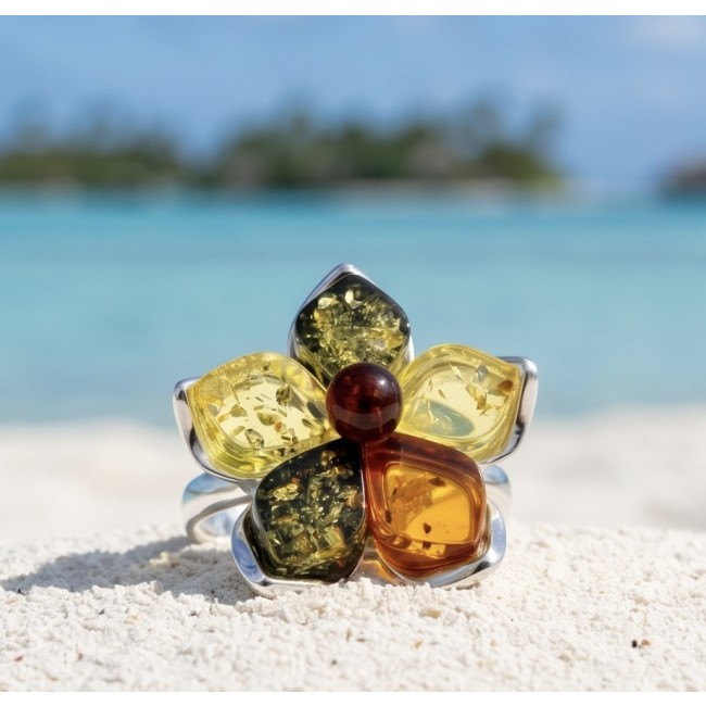 Golden Flower Authentic Baltic Amber rhodium over .925 Sterling Silver handcrafted ring; s. 7 adjustable - Close-up of Baltic Amber flower ring on sandy beach background.