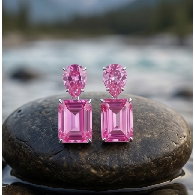 Large - Tiffany - authentic baquette cut 45.4 carat Pink Sapphire .925 Sterling Silver handcrafted Earrings - Pink sapphire earrings on stone, close-up, showcasing baquette cut.