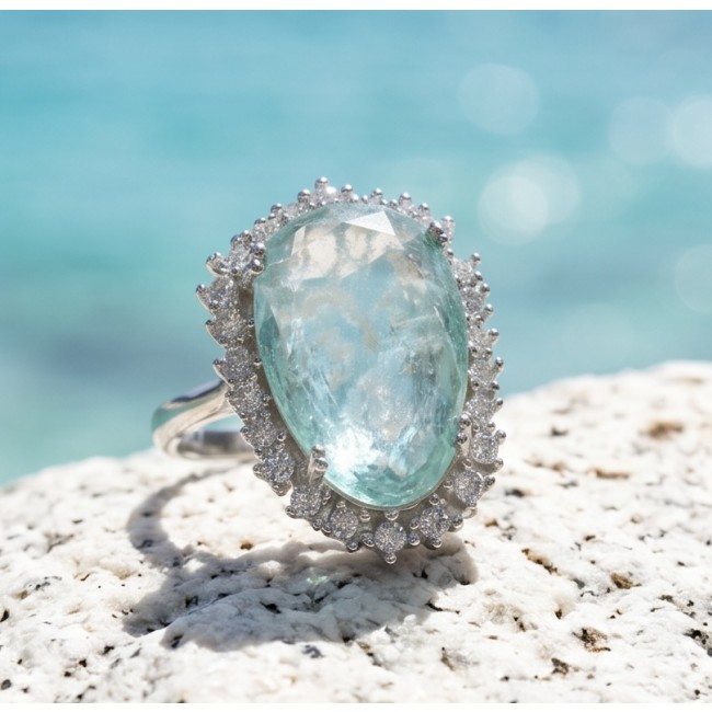 Angelina 14.9 carat authentic Aquamarine .925 Sterling Silver Handcrafted Ring size 7 - Close-up of Angelina aquamarine ring on a textured surface.