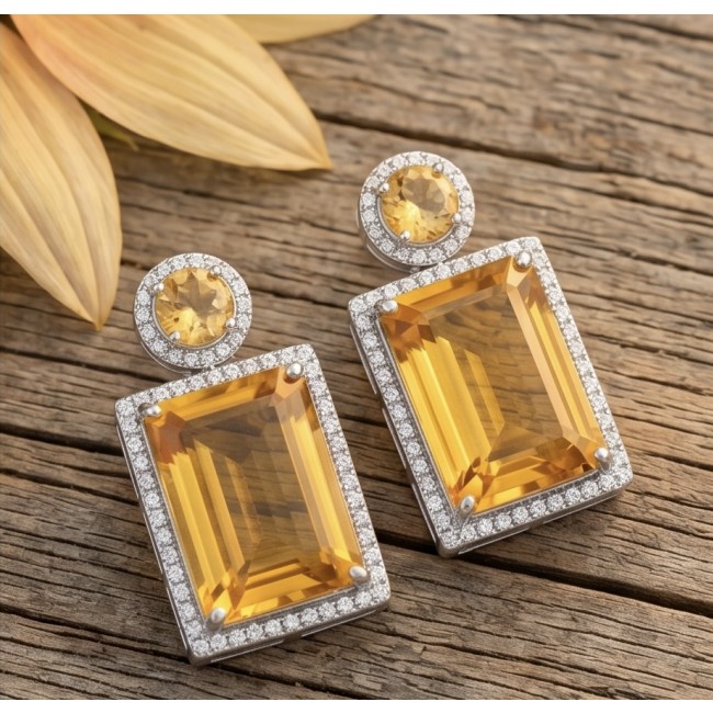 Summer Friday 17.8 carat Lemon Quartz rhodium over .925 Sterling Silver handcrafted Statement Earrings - Lemon Quartz earrings with diamond halo on wood background, top view.