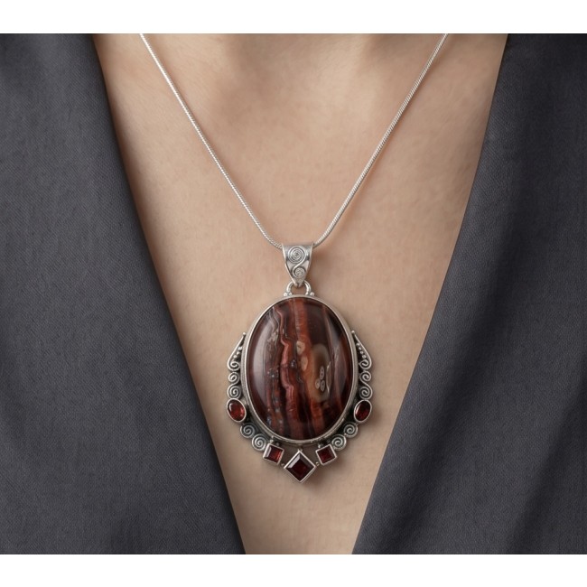 Incredible quality Silky Golden Tigers Eye .925 Sterling Silver handmade Pendant - Necklace worn, close-up of Tiger's Eye pendant with silver detailing.