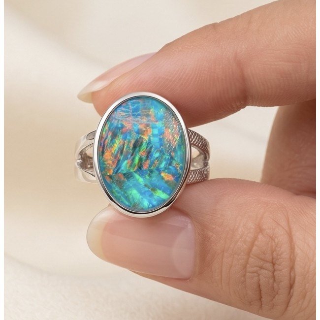 Endless Ocean Genuine 17.5 carat doublet Australian Opal .925 Sterling Silver handmade Ring size 6 1/4 - Close-up of Endless Ocean doublet Australian opal ring in hand.