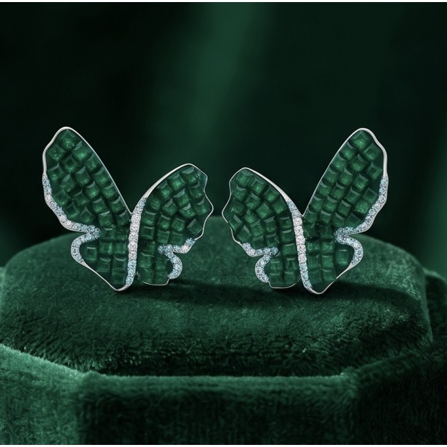 Incredible Butterflies genuine 15.5 CARAT Emerald .925 Sterling Silver handcrafted Earrings - Butterfly earrings with emerald details on green velvet background