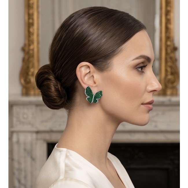 Incredible Butterflies genuine 15.5 CARAT Emerald .925 Sterling Silver handcrafted Earrings - Side view: Woman wearing Incredible Butterflies emerald earrings