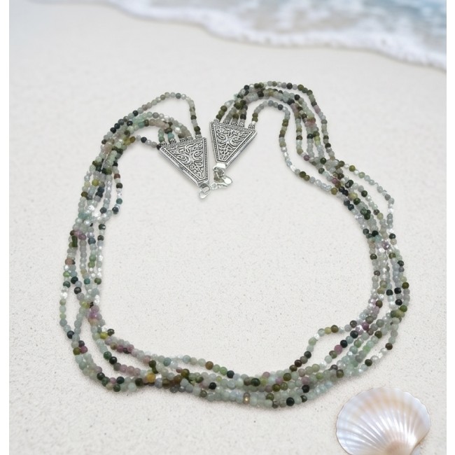 Infinity authentic 44.5 carat Brazilian Tourmaline .925 Sterling Silver handcrafted necklace - Top view of multistrand Brazilian tourmaline necklace on sand.